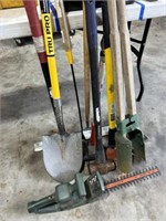 Shovels, axes, post hole digger, hedge cutter