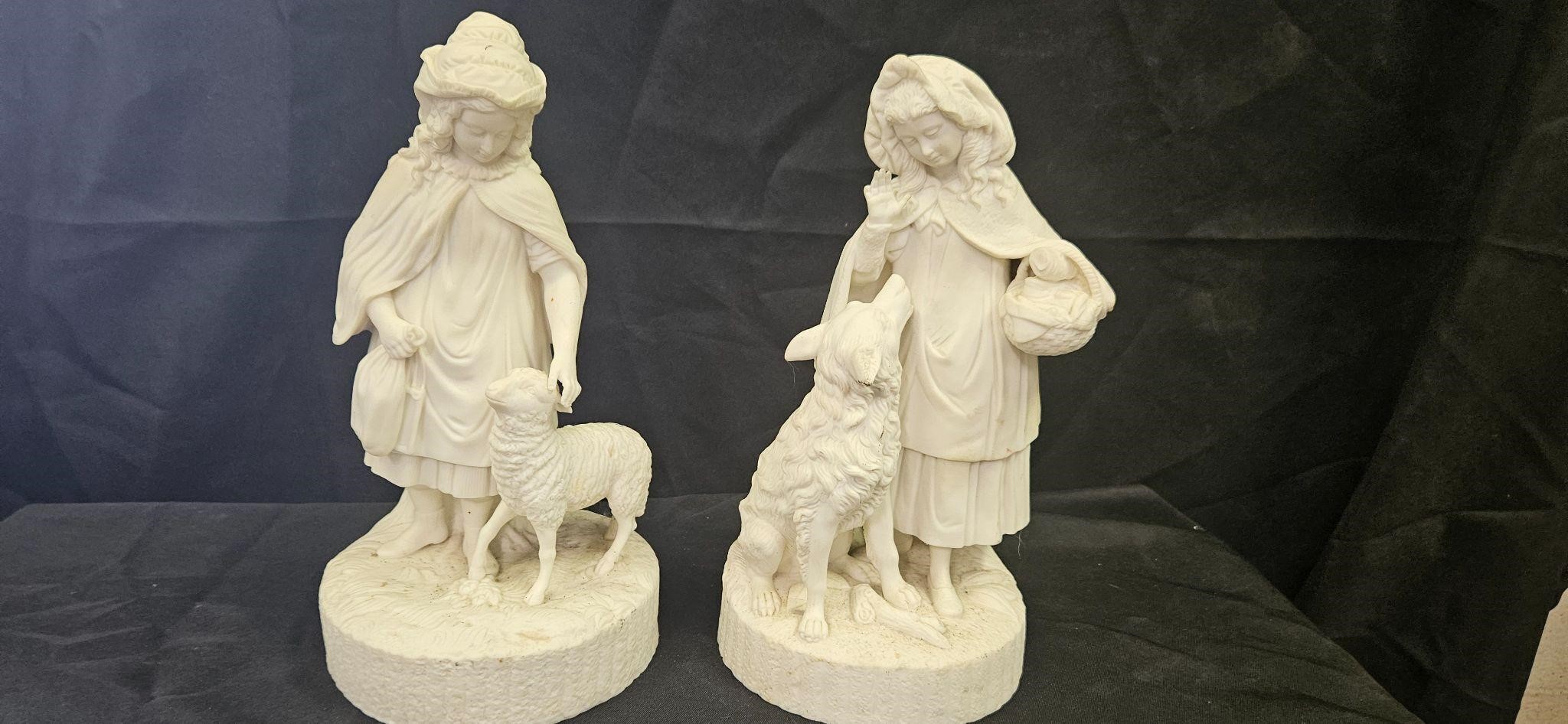 2 porcelain statues