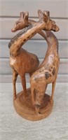 2 handcarved intertwined Giraffes