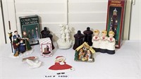 ASSORTED CARROLER FIGURINES AND RED GLASS VOTIVES