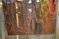 CONTENTS OF WALL (MISC BELTS & CORDS)