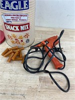 hot glue gun with tin of glue