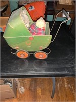 Small vintage cardboard/tin doll buggy with 2