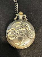 Pocket watch with motorcycle on case and heavy