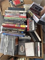 Box of cassettes and DVDs