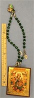 Faceted green stone necklace with an icon and meda