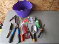 gardening tools in blue bucket