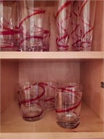 Set of glasses with red swirl