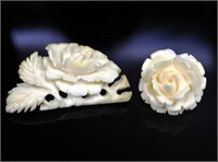 Two carved ivory brooches. C.1960