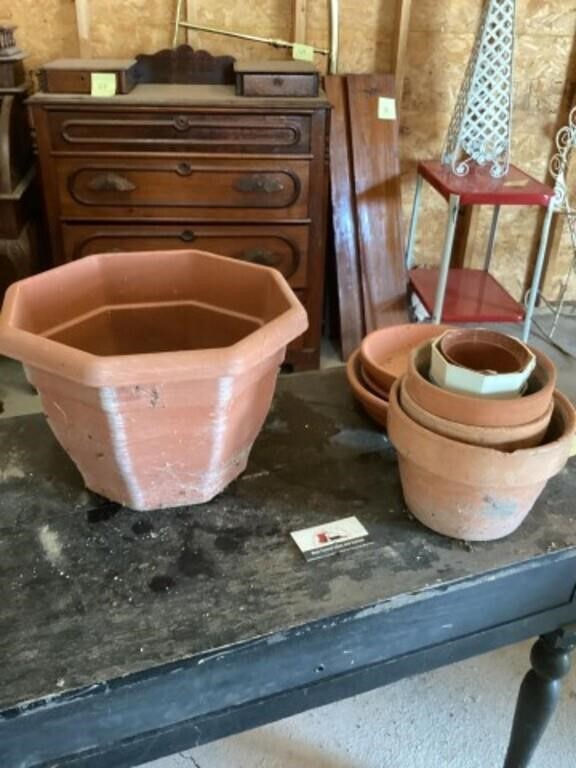 Clay and  plastic flower pots