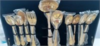 Gold color flatware set, most are still in