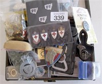Box of various badges, pins, pocket fobs