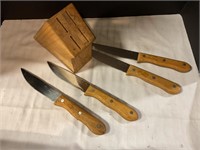 4 Stainless steel steak knives/wooden knife block