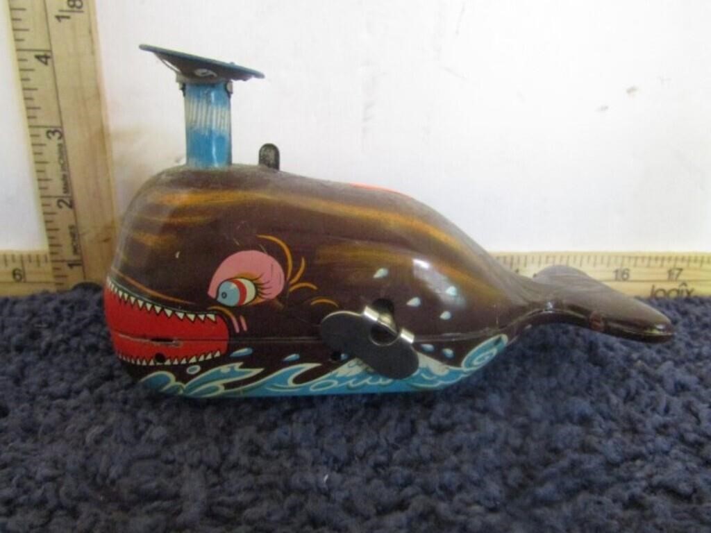 TIN WIND-UP BALL BLOWING WHALE TOY