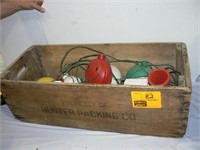 ANTIQUE WOODEN BOX WITH STRINGS OF CAMPING LIGHTS