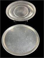 2 pewter plates.  9.5" round,  9" long oval.