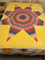 Bright yellow star quilt