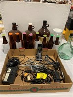 LARGE GROUP OF AMBER GLASS BOTTLES, FLAT W/ PHONE