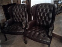 two faux leather chairs