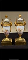 A pair of French sevres vases with golden bronze m