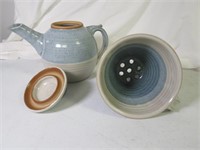 Blue stoneware tea pot and tea strainer