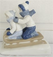 Porcelain Lids Sledding Figurine