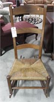 Antique rush bottom ladder back rocking chair