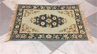 Blue and green floral rug
