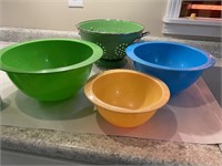 Metal colander, plastic measuring bowls