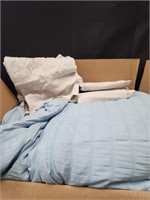 Blue and gray sheets and comforter
