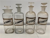 Group 4 Apothecary bottles with glass stoppers.