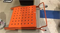 Orange metal ladder paint shelf or step plate