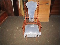 Antique rocking chair on casters.