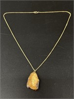 Ancient walrus ivory pendant with small gold nugge