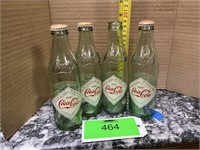 4 Coca-Cola commemorative bottles