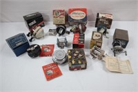 (9) FISHING REELS IN ORIGINAL BOXES: