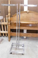 Chrome adjustable clothing store rack on casters