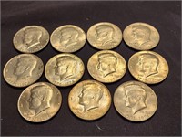 11 Kennedy half dollar Bicentennial coins.  Look