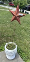 concrete planter with metal star decor