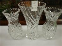 Three heavy cut crystal vases.