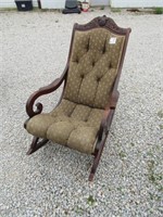 EARLY 1900'S ROCKING CHAIR W/ CARVING ON TOP.