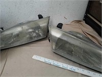 Pair of headlights for possibly BMW numbers are