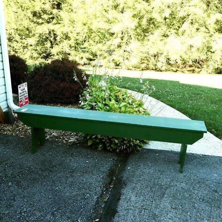 Long green wooden bench