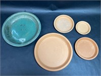 One Green and Four Terracotta Saucers