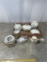 Porcelain dishes including sugar holders, bowls