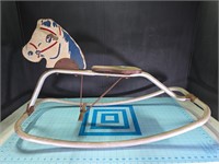 Antique metal rocking horse