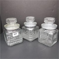 Three Glass Canisters