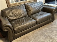 Very nice leather sofa with nailhead trim and in e