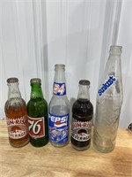 Five vintage soda pop bottles