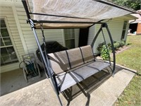 Patio swing covered (needs repair)